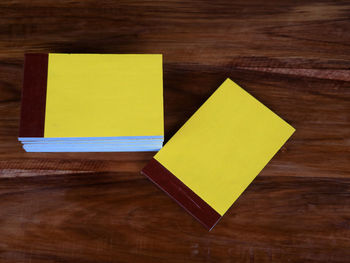 High angle view of yellow paper on table