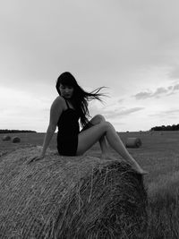 Full length of woman on field against sky