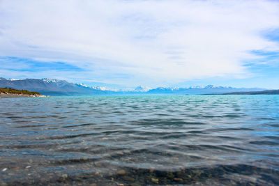 Scenic view of mountains against cloudy sky