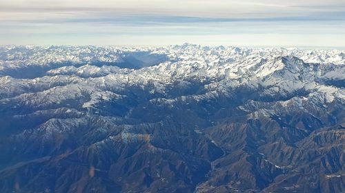 Scenic view of snowcapped mountains against sky