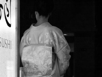 Rear view of a woman in kimono