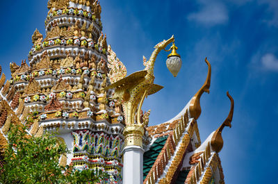 Low angle view of statue of temple against building