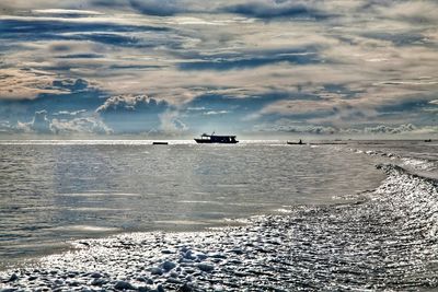 Scenic view of sea against sky during winter