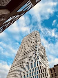 Low angle view of skyscraper against sky