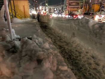 Illuminated city at night during winter