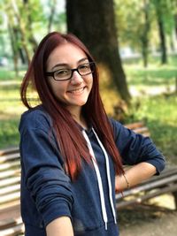 Portrait of smiling redhead young woman