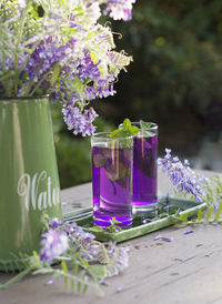 Lilac lemonade of basil and mint, vintage still life purple and green, 