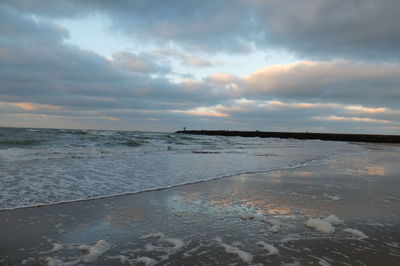 Scenic view of sea against sky at sunset