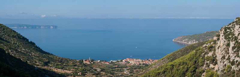 Panoramic view of sea and buildings against sky