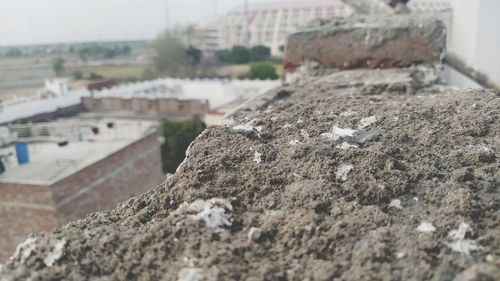 Surface level of retaining wall against buildings