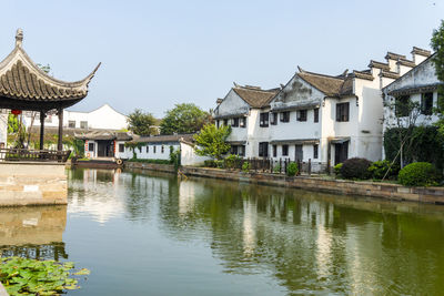 View of buildings by lake