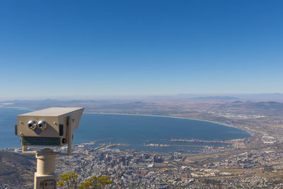 High angle view of cityscape against clear blue sky