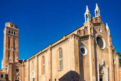 Low angle view of building against blue sky