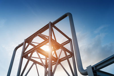 Low angle view of metallic structure against sky