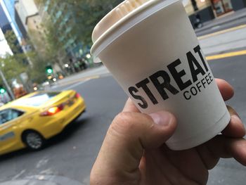 Close-up of hand holding car