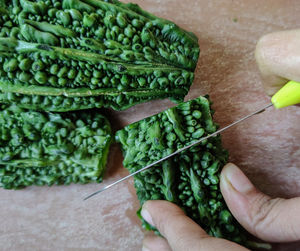 Close-up of hand holding vegetables