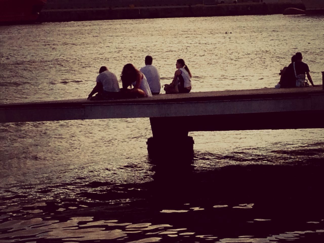 PEOPLE STANDING ON PIER