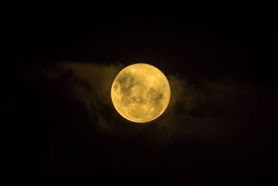 Low angle view of full moon in sky