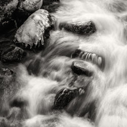 Water flowing through rocks in river
