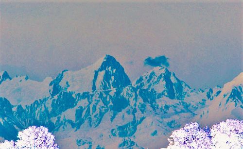 Scenic view of mountains against sky during winter