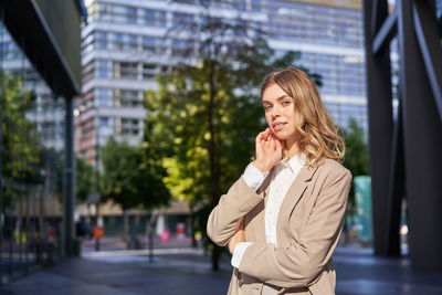 Young woman standing in city