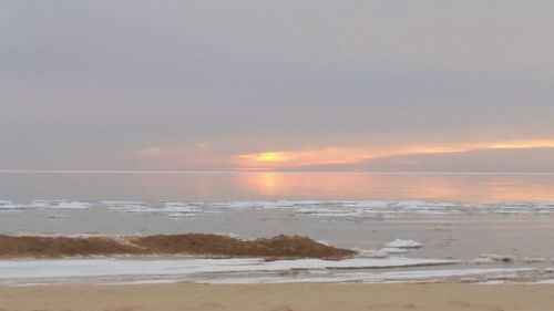 Scenic view of sea at sunset