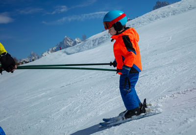 Man skiing on snow covered mountain