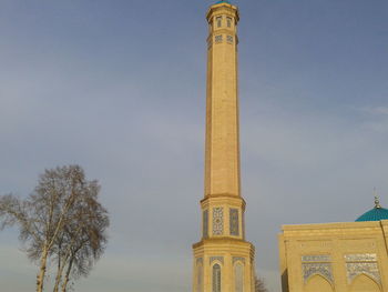 Low angle view of bell tower against sky