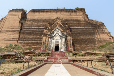 Exterior of temple building against clear sky