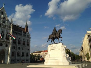 Low angle view of count gyula andrassy statue by hungarian parliament building