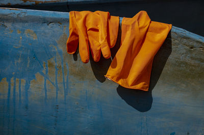Close-up of clothes drying against yellow wall