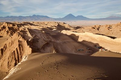 Scenic view of desert road against sky