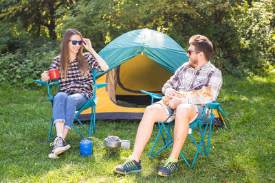 Men sitting in tent