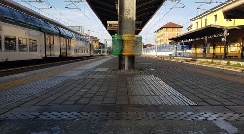 Rear view of woman standing on railroad station platform