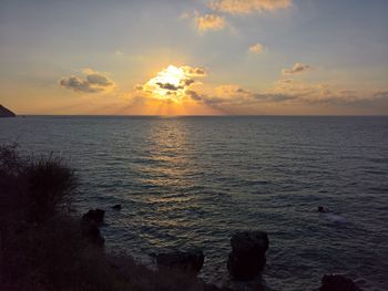 Scenic view of sea against sky during sunset