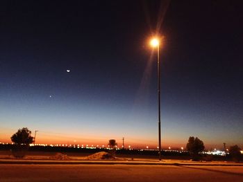 Illuminated street light at night