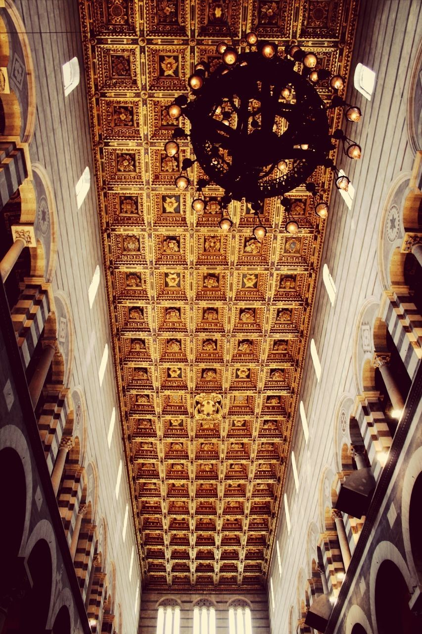 indoors, ceiling, interior, architecture, built structure, arch, place of worship, in a row, religion, lighting equipment, repetition, spirituality, hanging, travel, architectural feature, illuminated, architectural column, chandelier, church