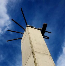 Low angle view of traditional windmill against sky