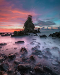 Scenic view of sea against sky during sunset