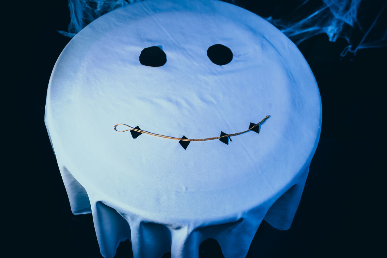 CLOSE-UP OF JELLYFISH AGAINST BLACK BACKGROUND