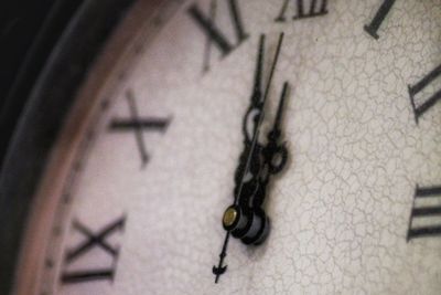 Close-up of clock on wall