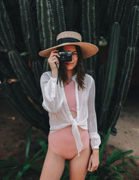 Portrait of a young woman wearing hat
