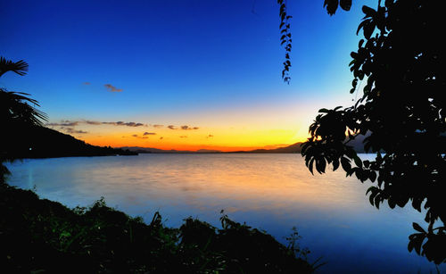 Scenic view of lake against sky during sunset