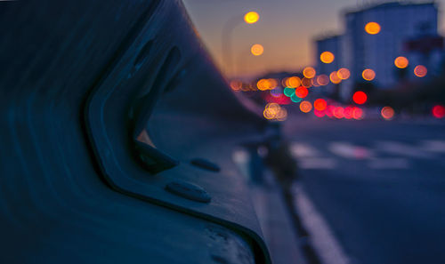 Close-up of car on road at night