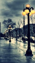 View of illuminated street lights at night