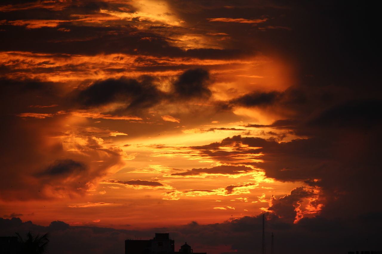 LOW ANGLE VIEW OF DRAMATIC SKY OVER SILHOUETTE LANDSCAPE