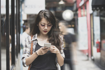 Young woman using mobile phone