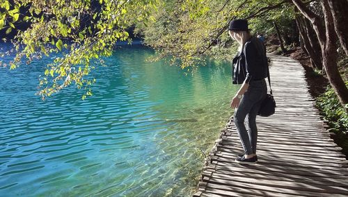 Full length of woman walking on lake