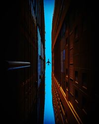 Directly below shot of buildings against sky