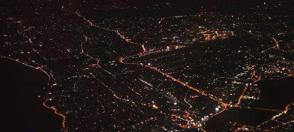 Low angle view of firework display at night